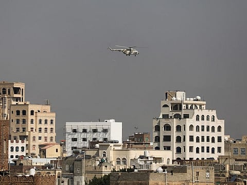 A military helicopter, operated by the Houthis, flies over Sana'a on September 21, 2022 for the first time since the Saudi-led coalition intervened in Yemen and controlled the country's airspace in 2015. 