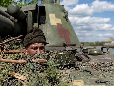 A Ukrainian soldier looks out from a tank in the frontline city of Lyman, Donetsk region, Ukraine, in a file photo.