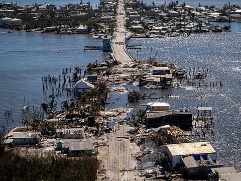 An aerial picture taken on September 30, 2022 shows the only access to the Matlacha neighbourhood destroyed in the aftermath of Hurricane Ian in Fort Myers, Florida.  
