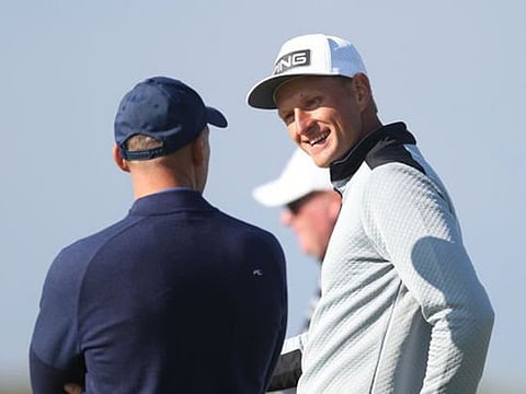 Dubai-based Adrian Meronk (right) chatting with amateur partner Andiy Shevchenko at the Alfred Dunhill Links Championship in Scotland.