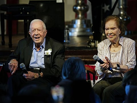 Former President Jimmy Carter and his wife former first lady Rosalynn Carter sit together during a reception to celebrate their 75th wedding anniversary Saturday, July 10, 2021, in Plains, Ga..