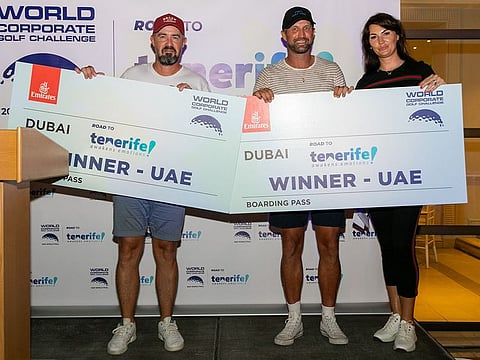 Winners of the UAE Final of the World Corporate Golf Challenge Ian Overton and Stuart Quinn, with Marta Biswas (right), owner and organiser of White Eagle Sport.
