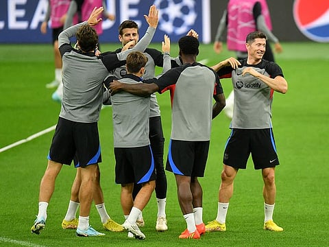FC Barcelona's Robert Lewandowski (right) and teammates during training at the San Siro ahead of their Champions League match against Inter Milan. 