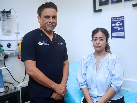 Egyptian expat Fatima Amin with Dr Sanjay Parashar who is currently treating her in Dubai.  The 30 year old had flown to another country for a liposuction and skin tightening procedure following which she contracted a severe bacterial infection and ended up on a wheelchair. 