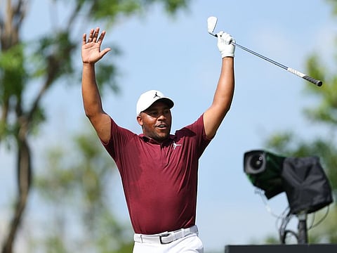 Harold Varner III of Niblicks GC reacts after making a hole-in-one on the seventh tee during the pro-am prior to the LIV Golf Invitational - Bangkok at Stonehill Golf Course on Thursday.