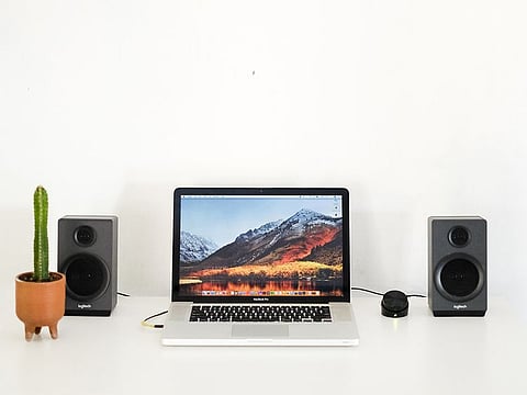 Some speakers will connect to both your laptop and desktop, adding enhanced sound and improving your entire experience.