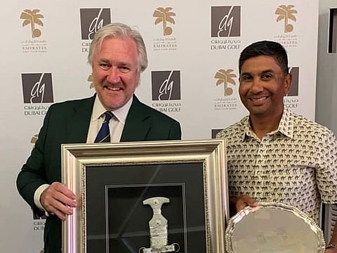 EGC senior's champion Rohit Gupta (right) with EGC men's club captain Campbell Steedman