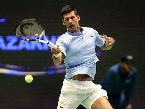 Serbia's Novak Djokovic hits a forehand return during his quarter-finals against Russia's Karen Khachanov.