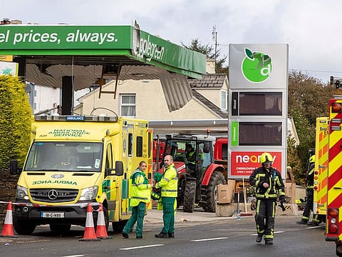 Emergency services attend the scene following an explosion in Creeslough, in the north west of Ireland on October 8, 2022. 