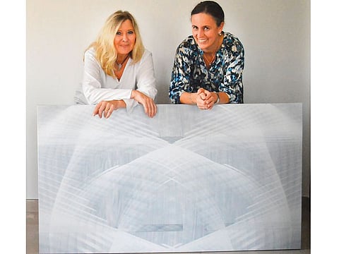 Sybille Pfaff, German Consul General in Dubai, right and Petra Kaltenbach  pose with the latter’s art installation