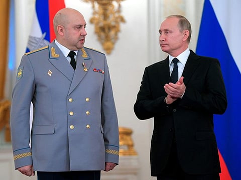 Russian President Vladimir Putin, right, applauds Col. Gen. Sergei Surovikin during an awards ceremony for troops who fought in Syria, in the Kremlin, in Moscow, on December 28, 2017.  