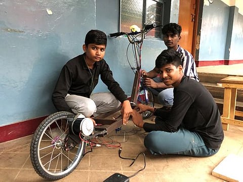 Prem Sagar with his co-learners working on an electric scooter at their learning centre in Whitefield, Bengaluru.
