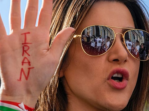 Iranians rally against the death of Amini, in front of the Universidad de Chile building in Santiago, Chile, on October 7, 2022. 
