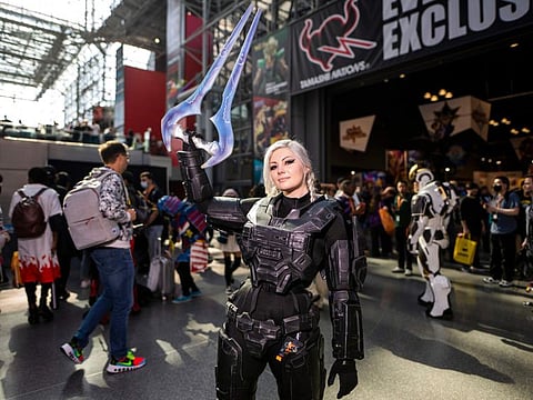 An attendee dressed as a character from the Halo video games poses during New York Comic Con at the Jacob K. Javits Convention Center on October 7, 2022. New York and other cities are straining under an influx of hundreds of migrants sent primarily by Republican governors from border states.  
