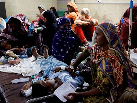 Women sit with their children suffering from malaria and fever, as they receive medical assistance at Sayed Abdullah Shah Institute of Medical Sciences in Sehwan. The UN has sounded alarms about the potential for a second crisis of waterborne and other diseases amid the inundation, which damaged many of Pakistan’s health facilities.