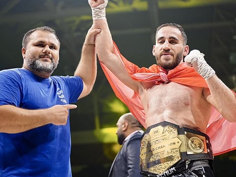 Turkey’s Serdar Eroglu (right) won the vacant light heavyweight world championship title at the Al Nasr Club’s Rashid Bin Hamdan Hall.