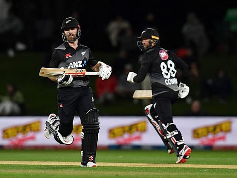 New Zealand's Devon Conway (right) and Kane Williamson run between the wickets during the match against Bangladesh of the Twenty20 tri-series at Hagley Oval in Christchurch.