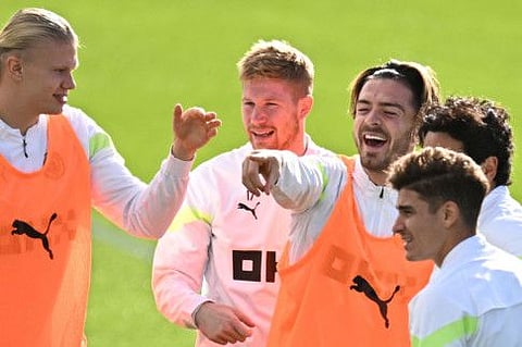 (From left) Manchester City's Erling Haaland, Kevin De Bruyne, Jack Grealish and Julian Alvarez react as they attend a training session at Manchester City training ground in Manchester on the eve of their UEFA Champions League Group G match against FC Copenhagen.