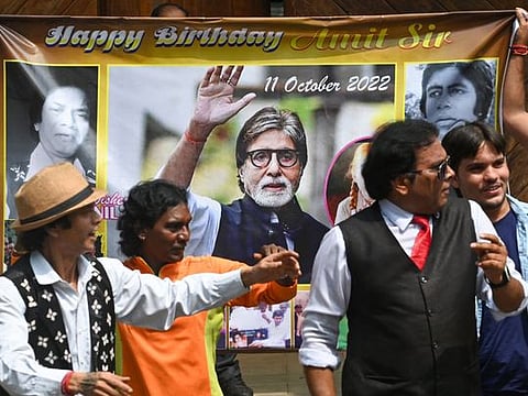 Fans and wellwishers of Bollywood actor Amitabh Bachchan dance outside his house on the occasion of his 80th birthday in Mumbai on October 11, 2022.