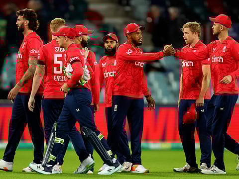 England players celebrate their victory in the second match of the Twenty20 series against Australia at Manuka Oval in Canberra.