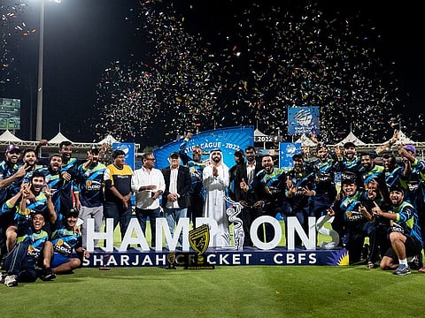 Colatta Chocolates celebrate after beating Karwan Cricket Club in the final at the Sharjah Cricket Stadium.