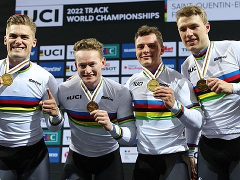 Matthew Richardson, Matthew Glaetzer, Leigh Hoffman and Thomas Cornish show their medals after a golden effort to take the men's team sprint world title at SQY2022.