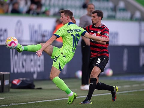 Wolfsburg's Polish star Jakub Kaminski (left).