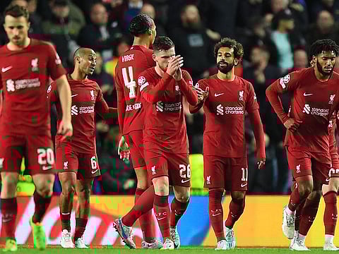 Liverpool's Mohamed Salah (third from right) celebrates scoring his team's sixth goal during the Uefa Champions League Group A match against Glasgow Rangers.