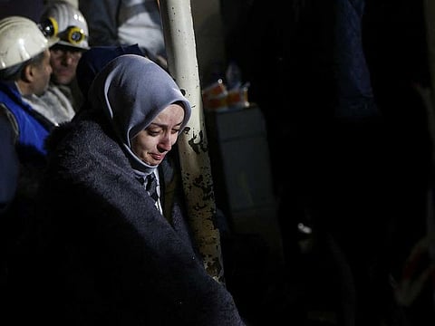Relatives and friends of mine workers wait outside the coal mine after an explosion, in Amasra in the northern Bartin province, Turkey October 15, 2022. 