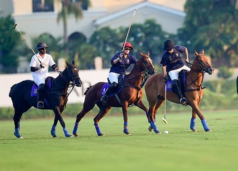 Lan To Capital (blue) and and Monte Carlo team battle it out for the Lan To Capital Luxury Polo Cup 2022 at Dubai Polo & Equestrian Club. 