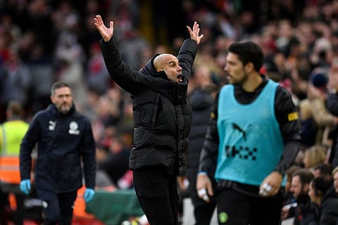 Manchester City manager Pep Guardiola gestures on the touchline during the English Premier League match against Liverpool at Anfield in Liverpool, north west England.