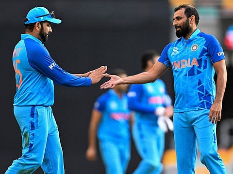 Indian captain Rohit Sharma with pacer Mohammed Shami during the ICC Men’s T20 World Cup warm-up game against Australia at the Gabba in Brisbane, Australia, on October 17, 2022.  