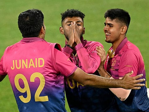 UAE's Karthik Meiyappan (centre) celebrates his hat-trick with teammates Junaid Siddique (left) and Aryan Lakra during the Group A match against Sri Lanka in Geelong on Tuesday.
