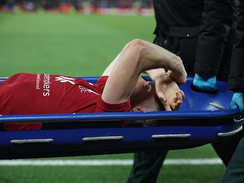 Liverpool's Diogo Jota comes off the pitch in a stretcher after sustaining an injury against Man City. The Portugal forward will miss the Qatar World Cup.