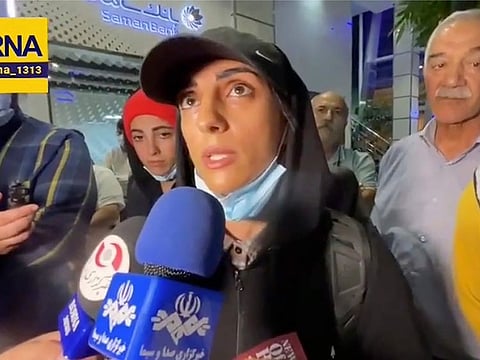 Elnaz Rekabi speaks to journalists at Imam Khomeini International Airport in Tehran, on October 19, 2022.  