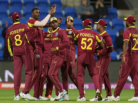 West Indies celebrate the dismissal of Zimbabwe's Sikandar Raza during the ICC mens Twenty20 World Cup 2022 match on Wednesday.