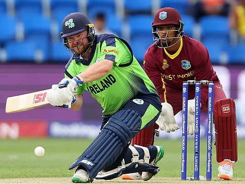Ireland's Paul Stirling plays a shot watched by West Indies' wicketkeeper Nicholas Pooran (R) during the ICC men’s Twenty20 World Cup 2022 cricket match at Bellerive Oval in Hobart on October 21, 2022. 