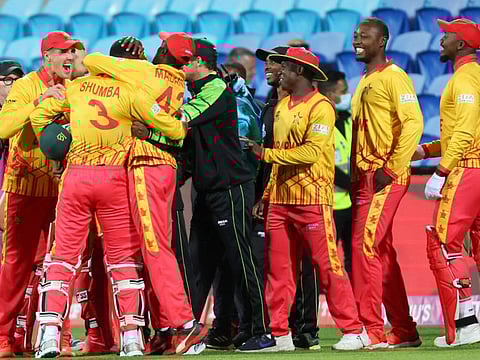 Zimbabwe players celebrate their victory against Scotland that gave them a spot in the Super 12 for the first time at Bellerive Oval in Hobart on Friday.