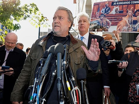 Steve Bannon, former White House chief strategist under former President Donald Trump, who was found guilty of contempt of Congress charges in July for refusing a subpoena about the January 6th Attack on the US Capitol, speaks to reporters after his sentencing hearing at District Court in Washington on October 21, 2022.  