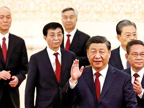 New Politburo Standing Committee members Xi Jinping, Li Qiang, Zhao Leji, Wang Huning, Cai Qi, Ding Xuexiang and Li Xi arrive to meet the media following the 20th National Congress of the Communist Party of China, at the Great Hall of the People in Beijing, China October 23, 2022. 