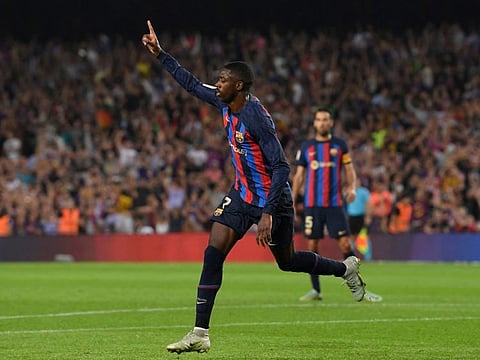 Barcelona's French forward Ousmane Dembele celebrates scoring his team's first goal during the Spanish league football match between FC Barcelona and Athletic Club Bilbao at the Camp Nou stadium in Barcelona.