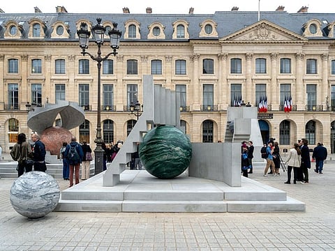 Alicja Kwade presented ‘Au cours des Mondes’ at Place Vendôme, the artist’s largest installation yet.