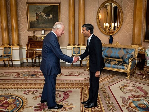 King Charles III welcomes Rishi Sunak during an audience at Buckingham Palace, London, where he invited the newly elected leader of the Conservative Party to become Prime Minister and form a new government, Tuesday, Oct. 25, 2022. 