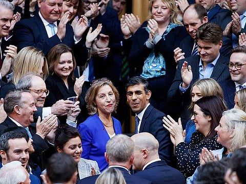 Rishi Sunak, centre right, greeted by conservative MPs after winning the Conservative Party leadership contest at the Conservative party Headquarters in London, on Monday. 