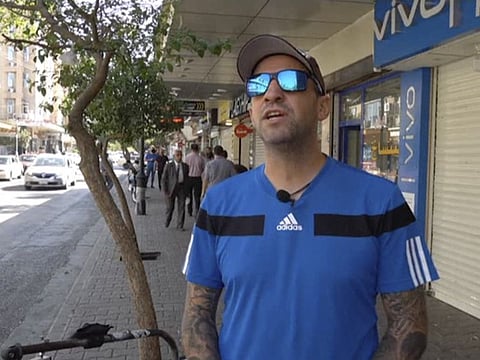 In this frame grab from video, Santiago Sánchez, who was documenting his travel on foot from Madrid to Doha for the 2022 FIFA World Cup, speaks to The Associated Press on a street, in Sulaymaniya, Iraq, on September 28, 2022. 