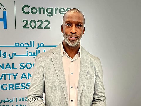 American sprinter and Olympian Michael Johnson speaking at a conference in Abu Dhabi. 