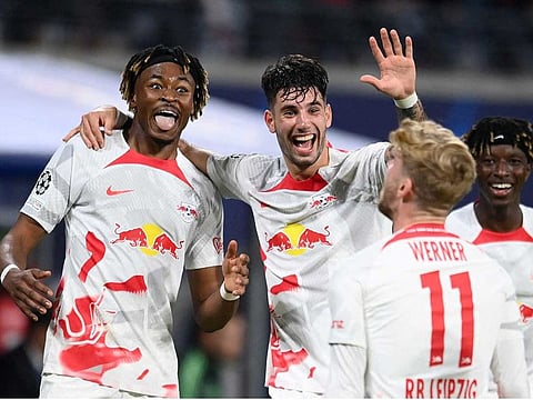 RB Leipzig's Timo Werner celebrates scoring their third goal with Mohamed Simakan and Dominik Szoboszlai. 