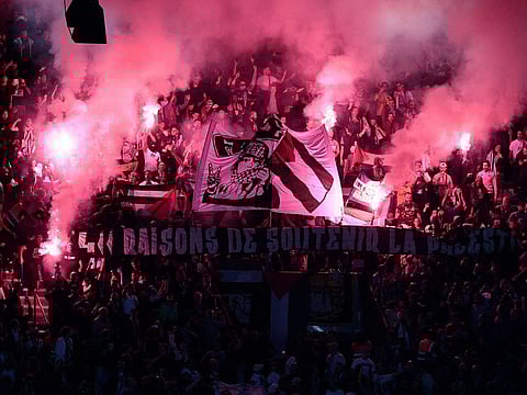 Paris Saint-Germain supporters cheer during the UEFA Champions League Group H second leg football match between Paris Saint-Germain (PSG) and Maccabi Haifa FC at the Parc des Princes stadium in Paris on October 25, 2022. 