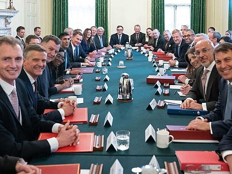 Britain's Prime Minister Rishi Sunak (6th L) poses for a photograph alongside members of his new cabinet at his first cabinet meeting in 10 Downing Street in central London on October 26, 2022. 