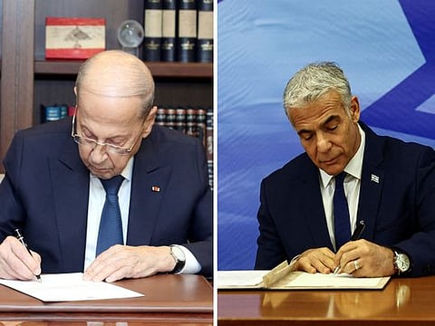 Lebanese President Michel Aoun and Israeli Prime Minister Yair Lapid sign the maritime deal in Beirut and Jerusalem, respectively, on Thursday.